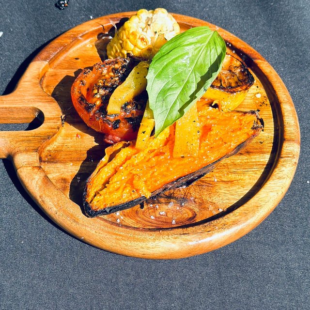Grilled vegetable sides: tomato, sweet potato, corn and roasted bell pepper